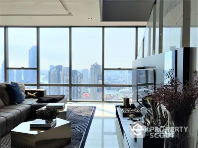 Luxurious high-rise living room with floor-to-ceiling windows offering a panoramic city skyline view, modern furnishings, and sleek design.