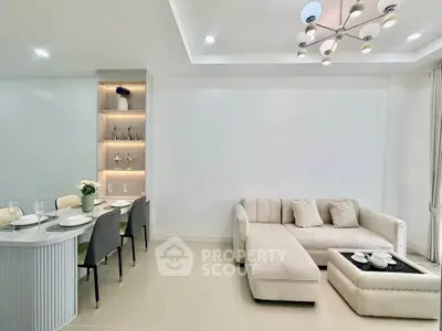 Modern living room with elegant dining area and stylish lighting