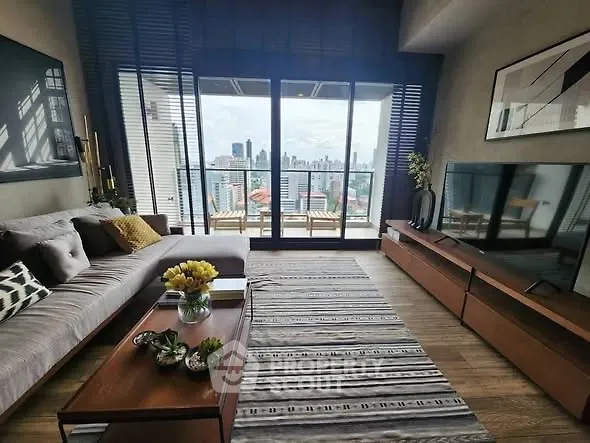 Modern living room with stunning city view and stylish decor