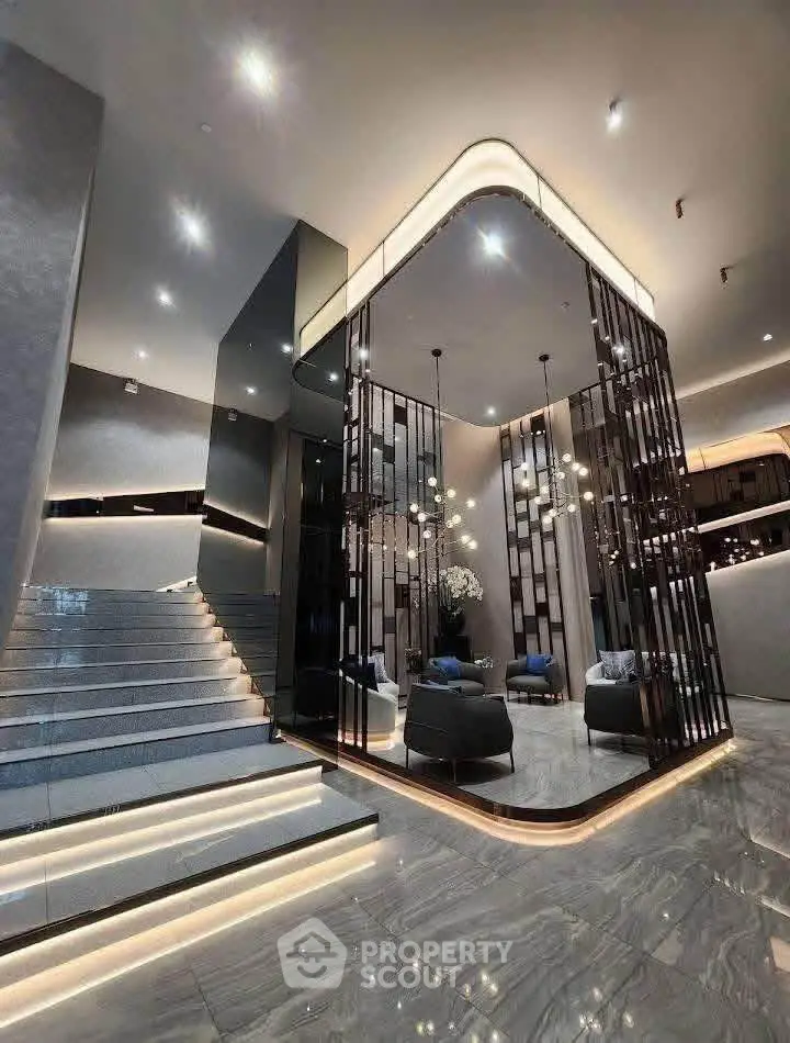 Luxurious modern building entrance with elegant lighting and stylish decor.