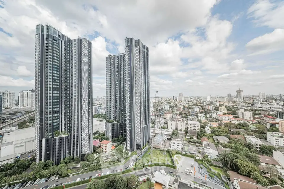 Stunning cityscape view with modern high-rise buildings and lush greenery.
