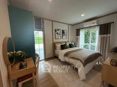Cozy bedroom with stylish decor and large window view
