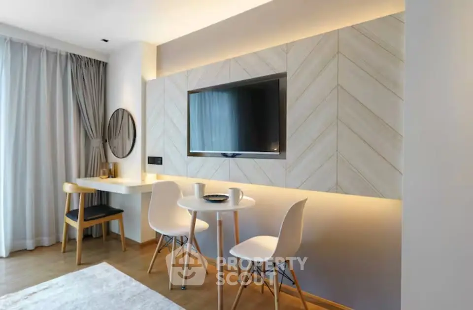 Modern living room with stylish decor and wall-mounted TV