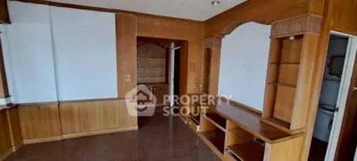 Spacious wooden interior with built-in shelves and cabinets, ideal for customization.