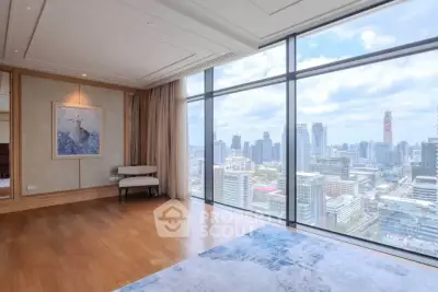 Luxurious high-rise living room with stunning city skyline view through floor-to-ceiling windows.