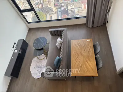 Stunning modern living room with city view, elegant furniture, and wooden flooring