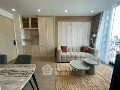 Modern living room with stylish furniture and city view balcony