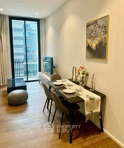 Modern living room with elegant dining area and balcony view in a stylish apartment.