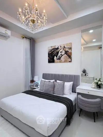 Luxurious bedroom with elegant chandelier and stylish decor