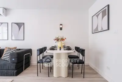 Modern living room with stylish dining area and contemporary decor