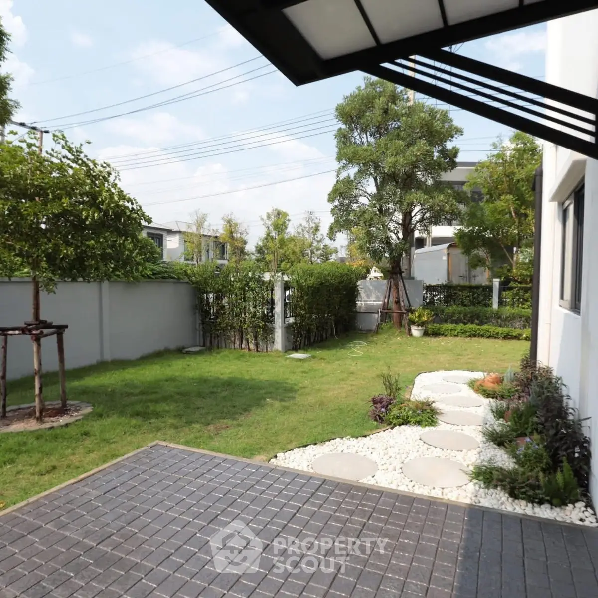 Charming garden view with lush greenery and modern landscaping in a serene residential area.