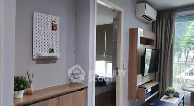 Modern living room with air conditioning and balcony view in stylish apartment.