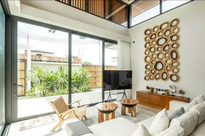 Stunning modern living room with large windows and stylish decor