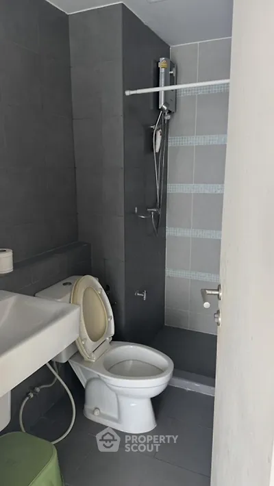 Modern bathroom with sleek gray tiles and contemporary fixtures