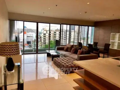Spacious modern living room with city view and elegant furnishings