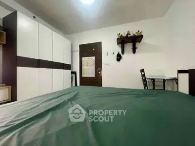 Spacious bedroom with modern wardrobe and cozy dining area