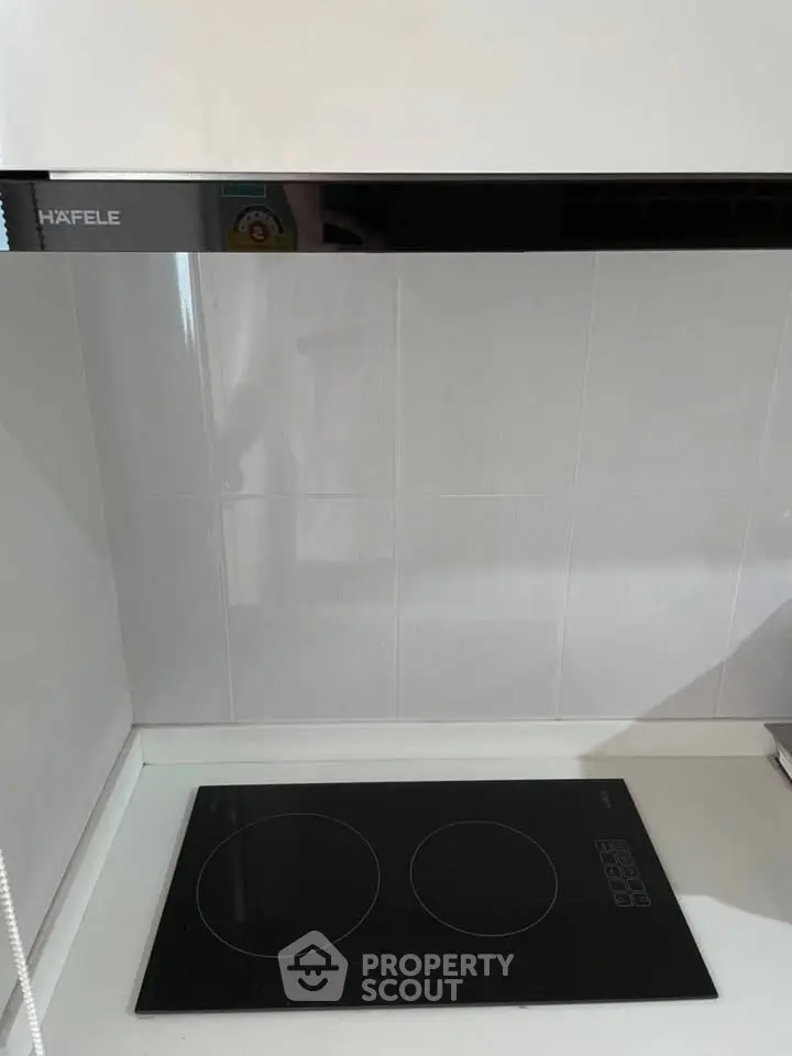 Modern kitchen with sleek induction cooktop and minimalist design