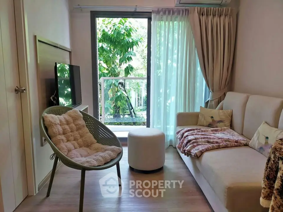 Cozy living room with modern decor and balcony view
