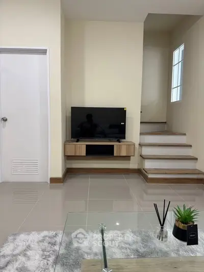 Modern living room with sleek TV setup and stylish decor
