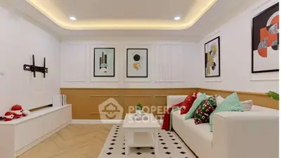 Stylish living room with modern decor and cozy seating area, perfect for relaxation and entertainment.