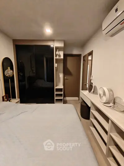 Modern bedroom with air conditioning and stylish decor