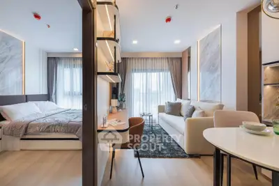 Modern studio apartment with stylish decor, featuring a cozy bedroom and elegant living area.