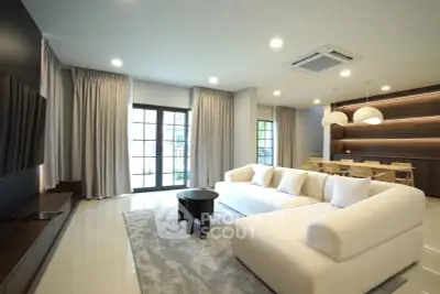 Spacious modern living room with elegant decor and ample natural light
