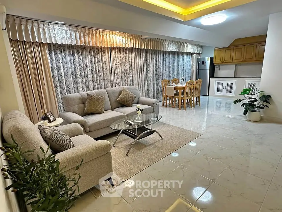 Spacious living room with elegant decor and dining area in modern apartment