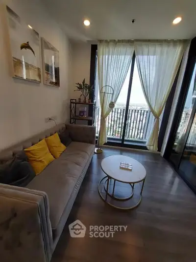 Stylish living room with modern decor and large balcony view