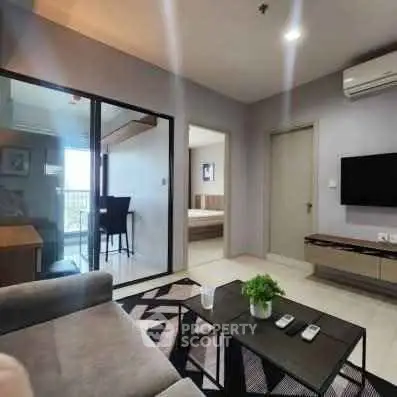 Modern living room with sleek furniture and open layout in a stylish apartment.