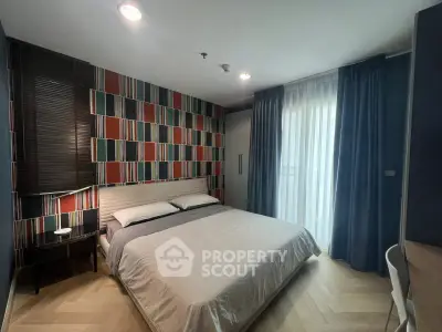 Modern bedroom with stylish geometric accent wall and cozy lighting