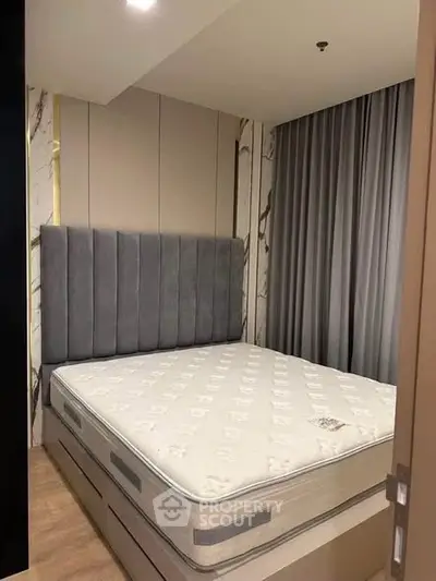 Modern bedroom with stylish headboard and elegant curtains