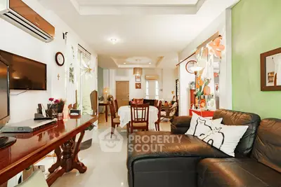 Spacious living room with modern decor and comfortable seating
