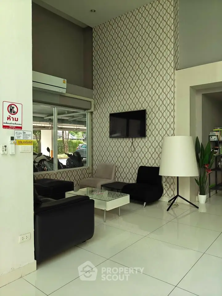 Modern living room with stylish decor and large windows in a contemporary home.