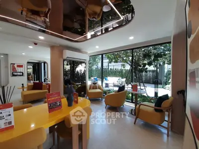 Stylish modern living room with vibrant yellow accents and garden view, perfect for relaxation and entertaining.