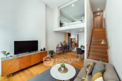 Modern duplex living room with high ceilings and stylish decor
