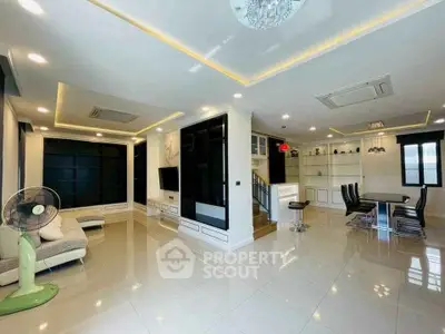 Spacious modern living room with elegant dining area and stylish decor