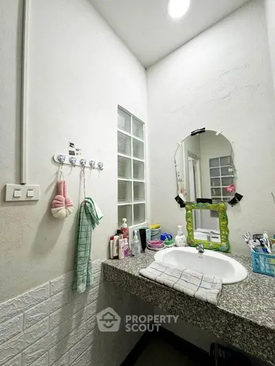 Charming bathroom with modern sink and stylish decor