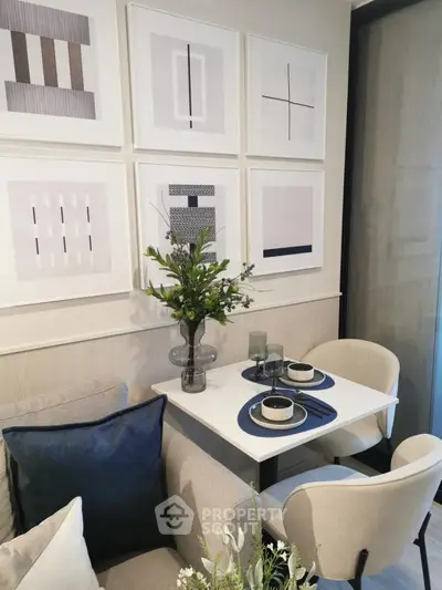 Stylish modern dining nook with elegant decor and contemporary art