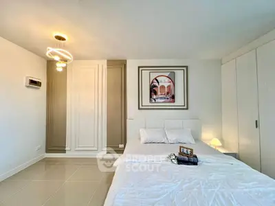 Modern bedroom with elegant decor and stylish lighting in a contemporary apartment.