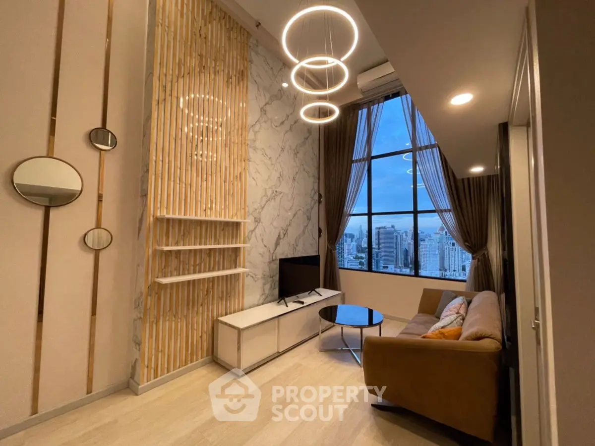 Modern living room with high ceilings and city view, featuring elegant lighting and stylish decor.