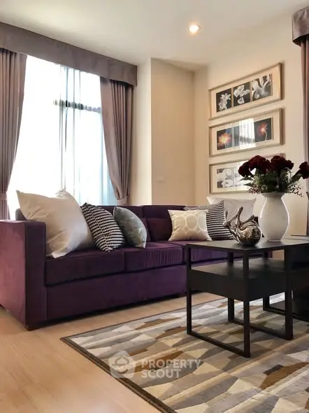 Elegant living room with plush purple sofa and stylish decor