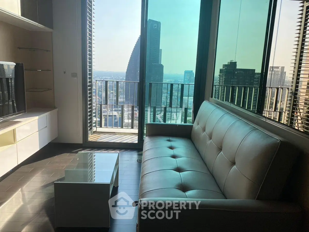 Modern living room with stunning city view and balcony access