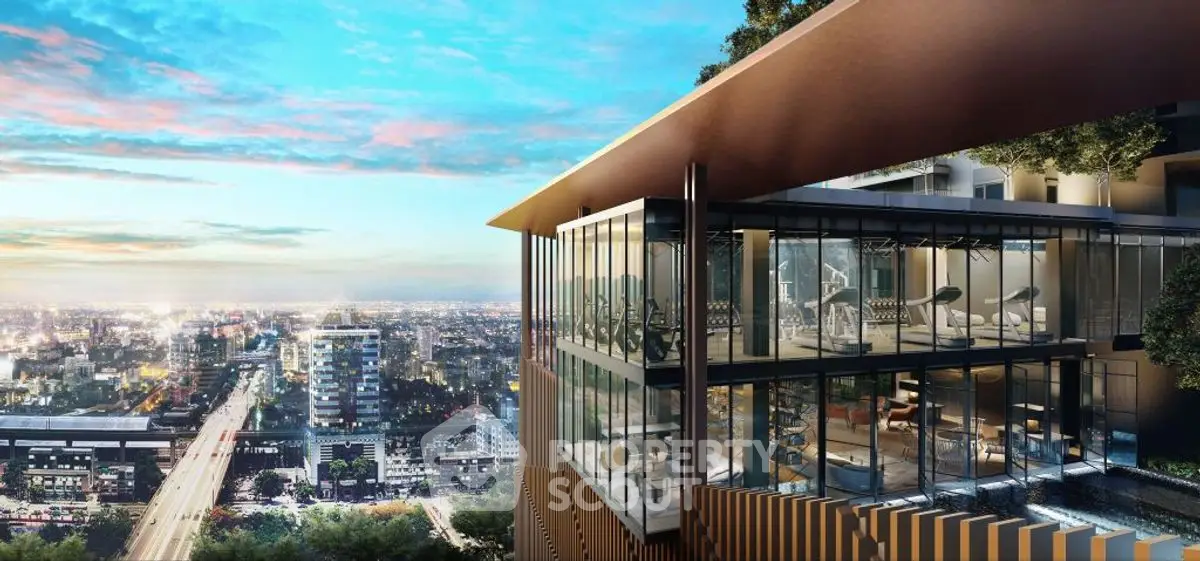 Stunning modern building with panoramic city view at sunset, featuring floor-to-ceiling windows.
