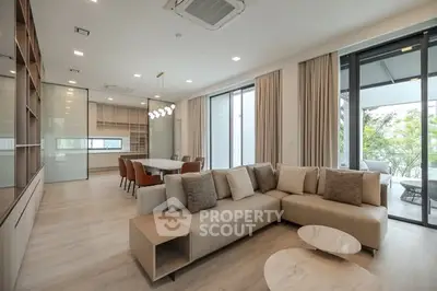 Spacious modern living room with open layout and large windows