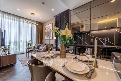 Luxurious open-layout living and dining area with modern decor and elegant lighting.