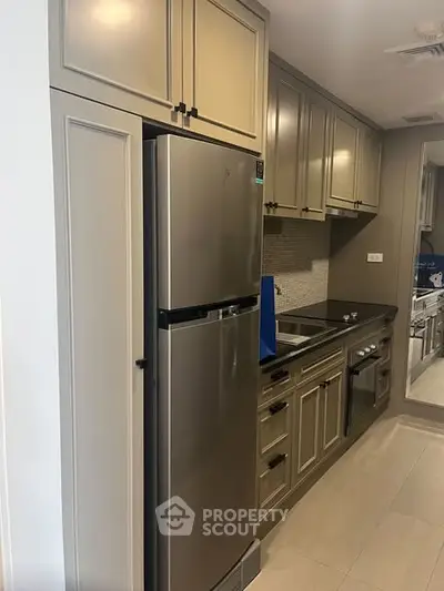 Modern kitchen with sleek cabinetry and stainless steel appliances