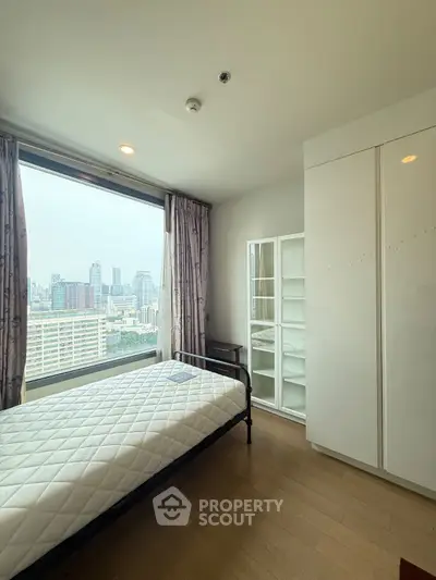 Modern bedroom with city view and minimalist design