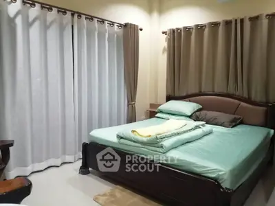 Cozy bedroom with elegant curtains and a comfortable bed