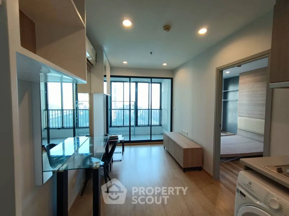 Modern apartment interior with open layout and balcony view
